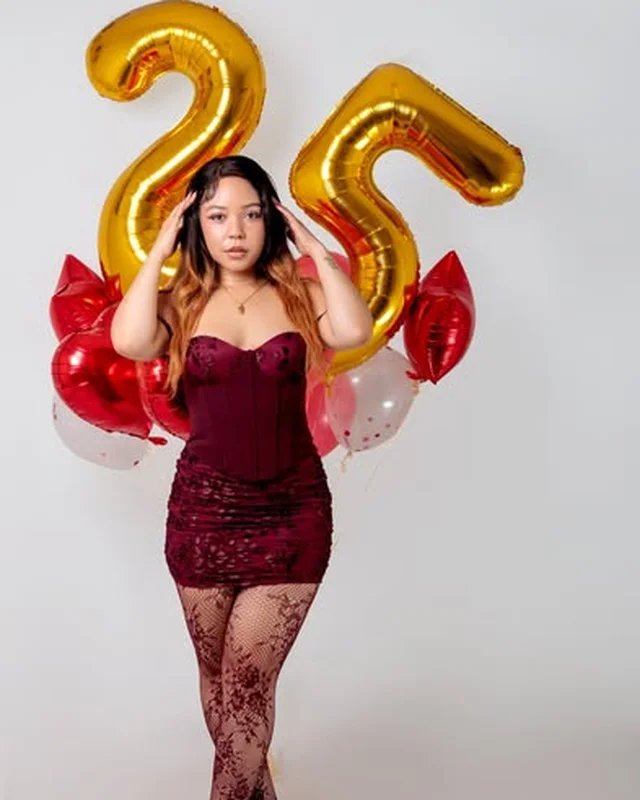 25th birthday portrait with gold balloon numerals